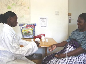 pregnant woman during a prenatal consultation receives sulfadoxine-pyrimethamine.
