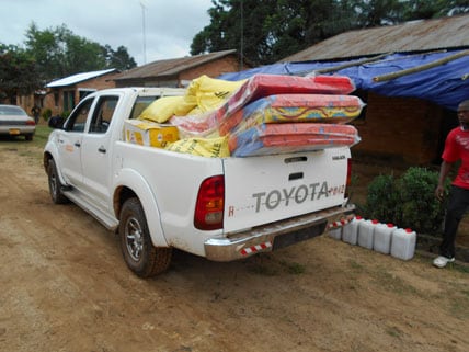 Truck transporting solidarity kits containing essential supplies for Ebola survivors returning home - Firestone District, Liberia, 2014