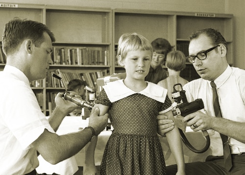 Old photo of a child getting vaccinated