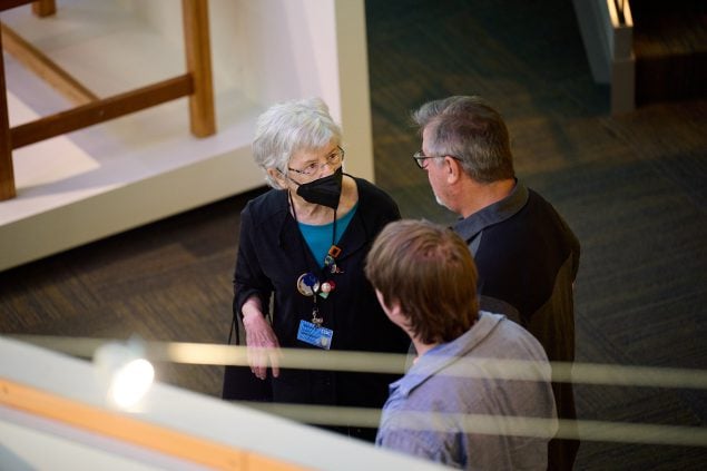 Visitors listening to a Museum docent