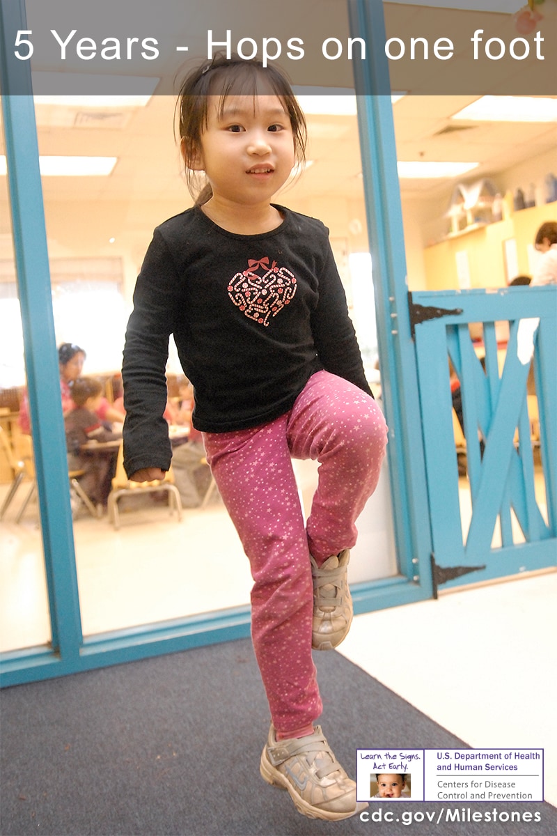 The child in this photo is hopping on one foot, a 5-year movement/physical development milestone.
