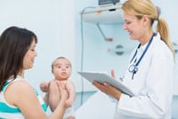 Mom with baby talking to doctor