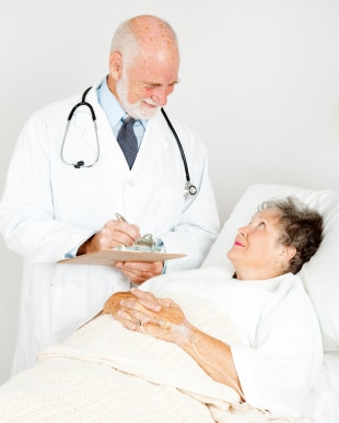 Doctor talking with patient and taking notes.