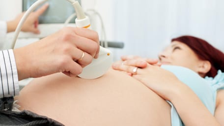 A pregnant woman having an ultrasound