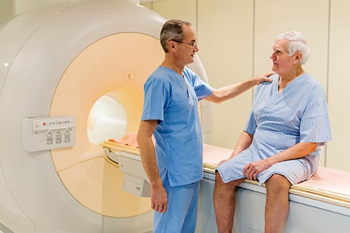 Male Radiology doctor consulting with a male patient