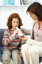 Mom giving treating young girl's asthma