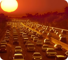 hazy sunset over traffic jam