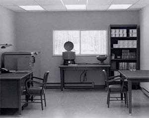 A black and white image an exam room in the Arctic Investigations Program's previous building.