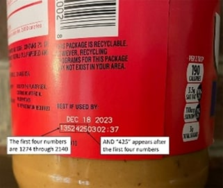 A peanut butter jar with dates on it