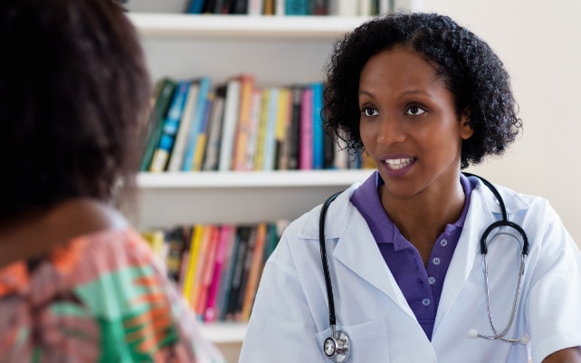 African American physician consulting with a patient