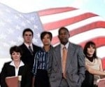 Group standing in front of American flag