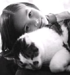 Youth with pet cat.