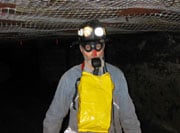 Miner wearing CCER (closed-circuit escape respirator)