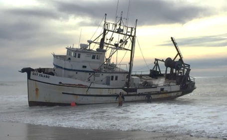 Commercial fishing vessel Day Island on Ventura Beach, California, after grounding resulting from human fatigue.