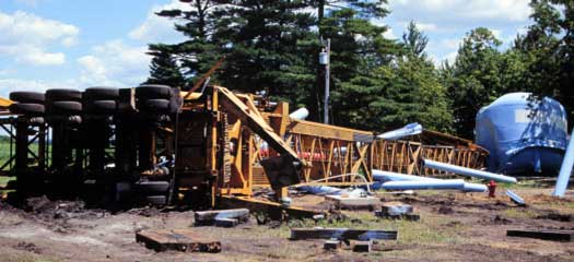 Photo 2 -- View of the crash scene taken during investigation -- photo shot from the rear of the crane trailer.