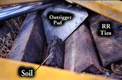 Photo 6 -- Failed outrigger pad and cribbing timbers.