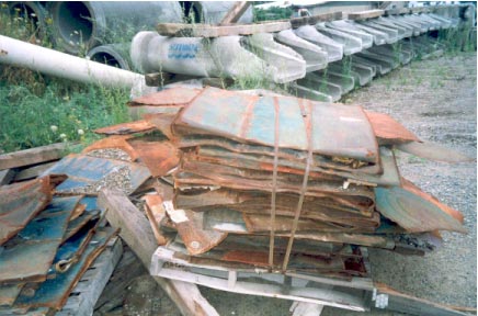 Stack of 55-gallon drums onsite opened with the hand held opener
