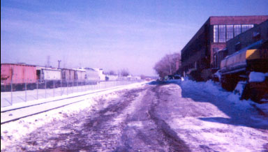 Service Road Between Building and Railroad Track