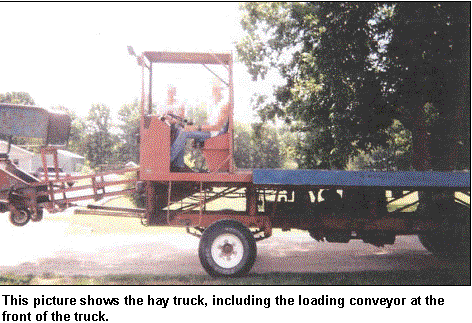 image shows the
hay truck including the load coveyor at the front of the truck