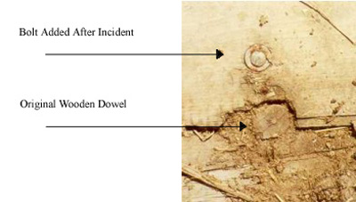 image showing the 
original wooden dowel and the bolt added after the incident