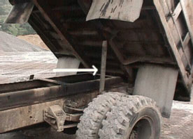 arrow points to permanently attached body support installed after the incident