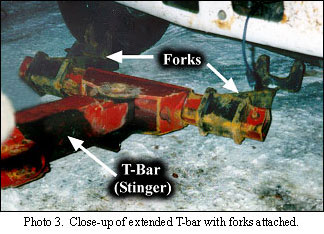 close-up of extended T-bar with forks attached.