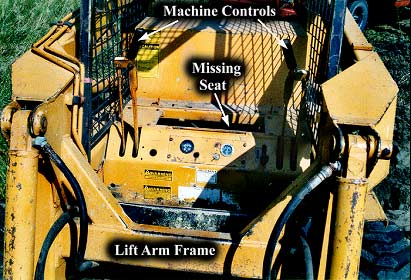View of loader showing missing seat and seatbelt