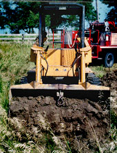 Photo 4 -- View of loader bucket full of dirt.