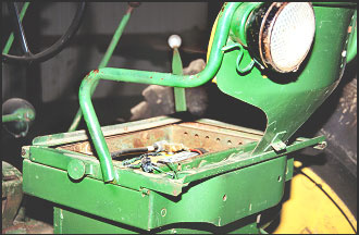 View of left side of seat, showing sliding track and armrests welded to the seat edge