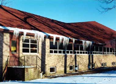 Photo showing icicles hanging on the church roof.