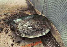 Figure 3.  Tank base against plant fence.