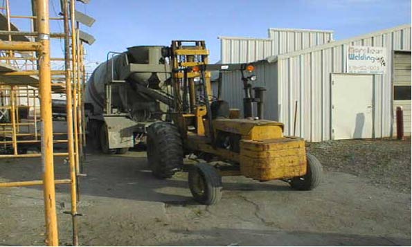 Picture #7:  Forklift and cement truck taken shortly after accident.