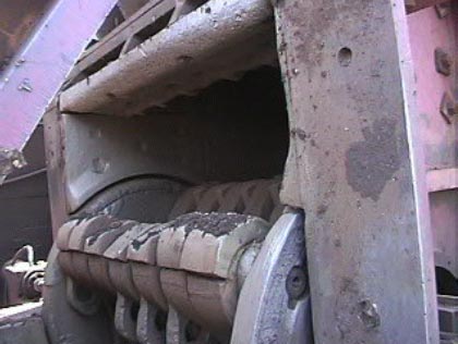 Exhibit #5. Left side view of the drum and hammers within the hopper.