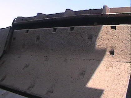 Exhibit #6. Right side view of the hydraulic throw-out door that crushed the victim.