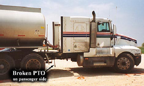 Photo 2 - Passenger side of truck showing broken PTO shaft.