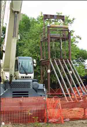 Temporary steel tower to handle liner