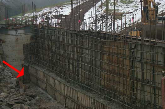 Picture of the opposite form being poured. This is how the other side looked when forms broke, trapping a worker waist high in cement.