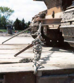Figure 13. Improper attachment of loader to trailer bed