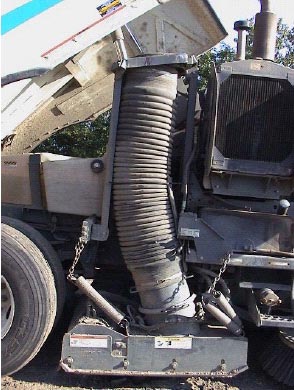 Figure 2. 12 inch diameter suction hose with hopper raised to dump debris.