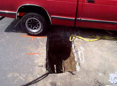 the incident site, with the pick-up truck and the utility trench located along street