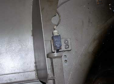 Exhibit #7. View of the safety switch that cuts the power to the machine when the door is open.