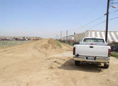 Exhibit #1. The above picture is the asphalt road where the incident occurred, looking west.