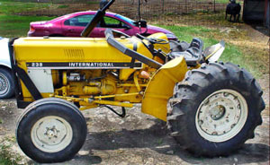 Photo 1 – Side view of tractor showing rollbar collapsed forward.
