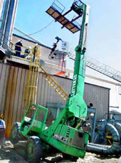 Photo 1 – Police photo of the scene showing the new catwalk, and the boom forklift, leaning to the right.
