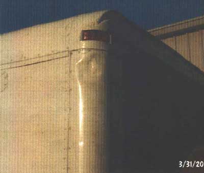 Picture of the dent caused by the cargo truck hitting the bucket with the traffic technician in it.