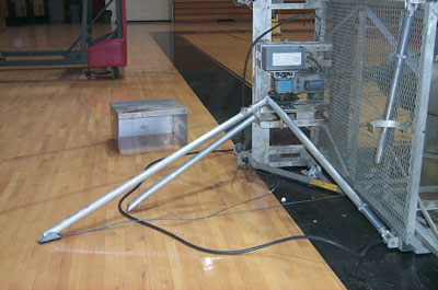Picture of control ground control panel on its side and outrigger used to stabilize the lift. Notice it had been extended for use.
