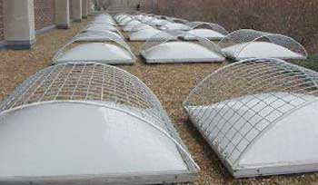 Photo. Skylight (typ.) with outer grids installed to prevent falls through them to the floor, below.