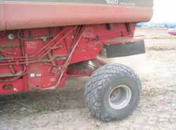 Photo 3. Above/Left. Newer combine and larger straw deflection shield.