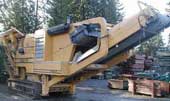 Portable rock crushing system.