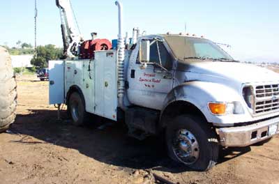 Exhibit #3. The victims’ truck with the boom that made contact with the high voltage lines.